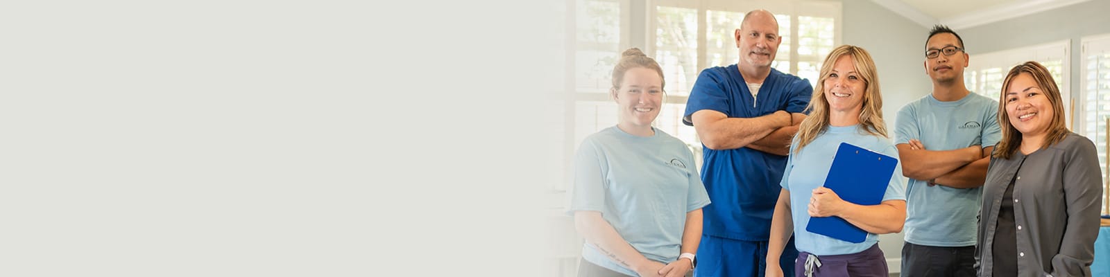 Several rehab therapists in the rehab gym
